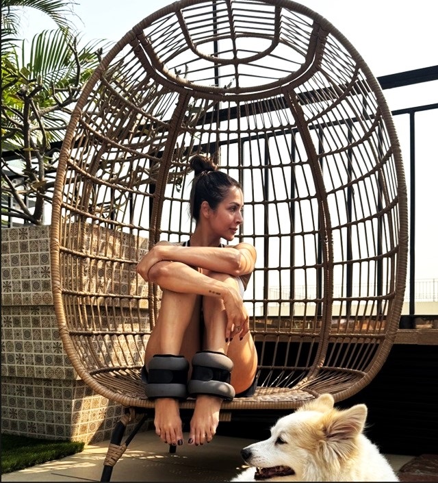 Malaika Arora starts her day with yoga, sunshine and her furry friend